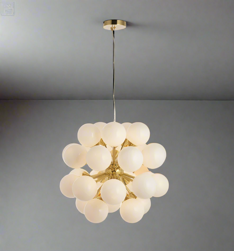 What can you say about this 28 light brushed gold pendant, speaks for itself. Huge WOW factor.&nbsp;&nbsp; To add an exceptional stylish look to your home, this is the perfect statement light for your living room, hall or dining room.&nbsp; Globe lighting is always so contemporary and wwith 28 lights, vey bright.


H: 163 cm W: 55 cm H: 55 cm