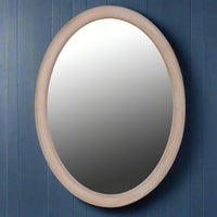 This Scandi-inspired oval wall mirror is designed with a smooth natural wood frame that adds warmth and minimal elegance to any room