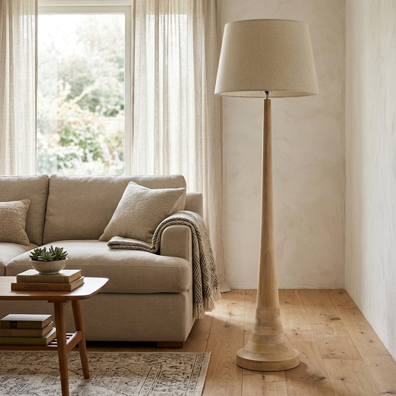 Natural wooden floor lamp with tapered base in a living room