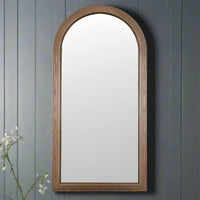 An arched mirror in wood, ash wood, a natural light wooden framed arched mirror.&nbsp; Natural wooden mirrors are definitely making a comeback, great in industrial or contemporary homes.&nbsp; The mirror combines a minimalist aesthetic and classical architectural curves.&nbsp; &nbsp;Perfect for an entryway, bedroom and living room particularly in interiors aiming for Scandi or organic modern looks.
