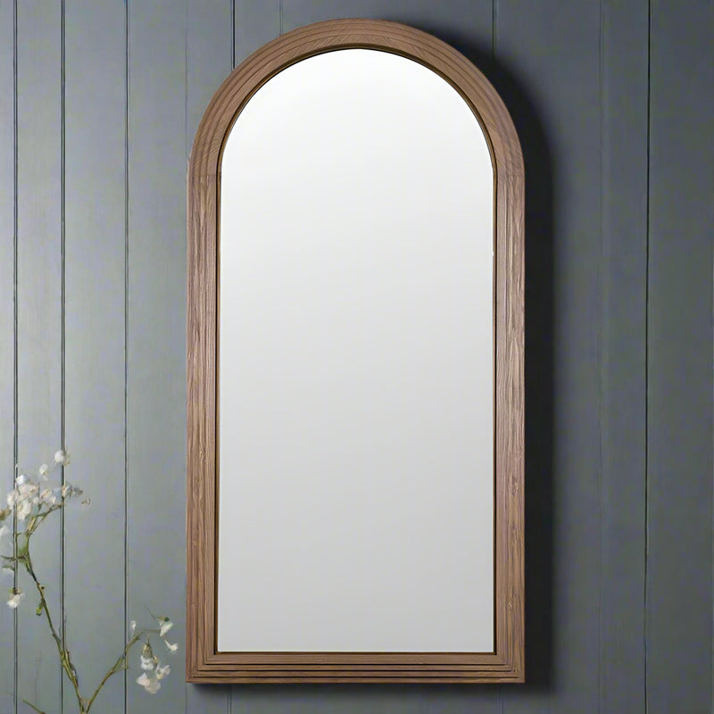 An arched mirror in wood, ash wood, a natural light wooden framed arched mirror.&nbsp; Natural wooden mirrors are definitely making a comeback, great in industrial or contemporary homes.&nbsp; The mirror combines a minimalist aesthetic and classical architectural curves.&nbsp; &nbsp;Perfect for an entryway, bedroom and living room particularly in interiors aiming for Scandi or organic modern looks.