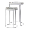 A very unusual set of two side tables, one nested below the other, circular tables on a white metal frame.&nbsp; The trays, which are detachable and can be used independently, have a traditional blue and white willow pattern style print on them. They are set off with a gold rim to the edge of the trays which lifts them and gives them a luxurious look. They combine modern minimalism with a classic scenic decorative top. Perfect in a contemporary setting, a cottage or period home.&nbsp;