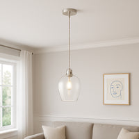 Tall clear glass pendant with nickel fitting and grey twisted flex. Over a kitchen island, in a hall or on a stairwell, very versatile lighting