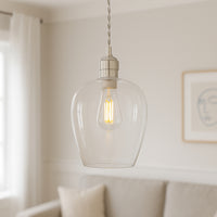 Tall clear glass pendant with nickel fitting and grey twisted flex. Simple pendant but with a lot of impact, you can easily double up or triple up with this pendant. Over a kitchen island, in a hall or on a stairwell, very versatile lighting