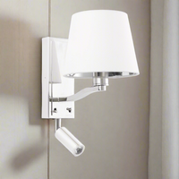 Nickel plated wall light with a white vintage faux silk shade. This light has an adjustable LED light attached for extra light. Suitable as bedside wall lights. Great in a living room with the added benefit of reading by the LED light.