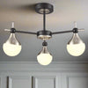 Brushed gold and three opaque glass globe ceiling light.&nbsp; Semi-flush on a back and gold metal fixture creating stunning mix of colours for both contemporary and classic settings. This stylish semi-flush globe ceiling light pendant would look amazing in a bedroom, hall over a dining table. The mixture of colours in the metal on this semi flush globe ceiling light is perfect for a contemporary home.