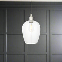 Tall clear glass pendant with nickel fitting and grey twisted flex. Simple pendant but with a lot of impact, you can easily double up or triple up with this pendant. Over a kitchen island, in a hall or on a stairwell, very versatile lighting