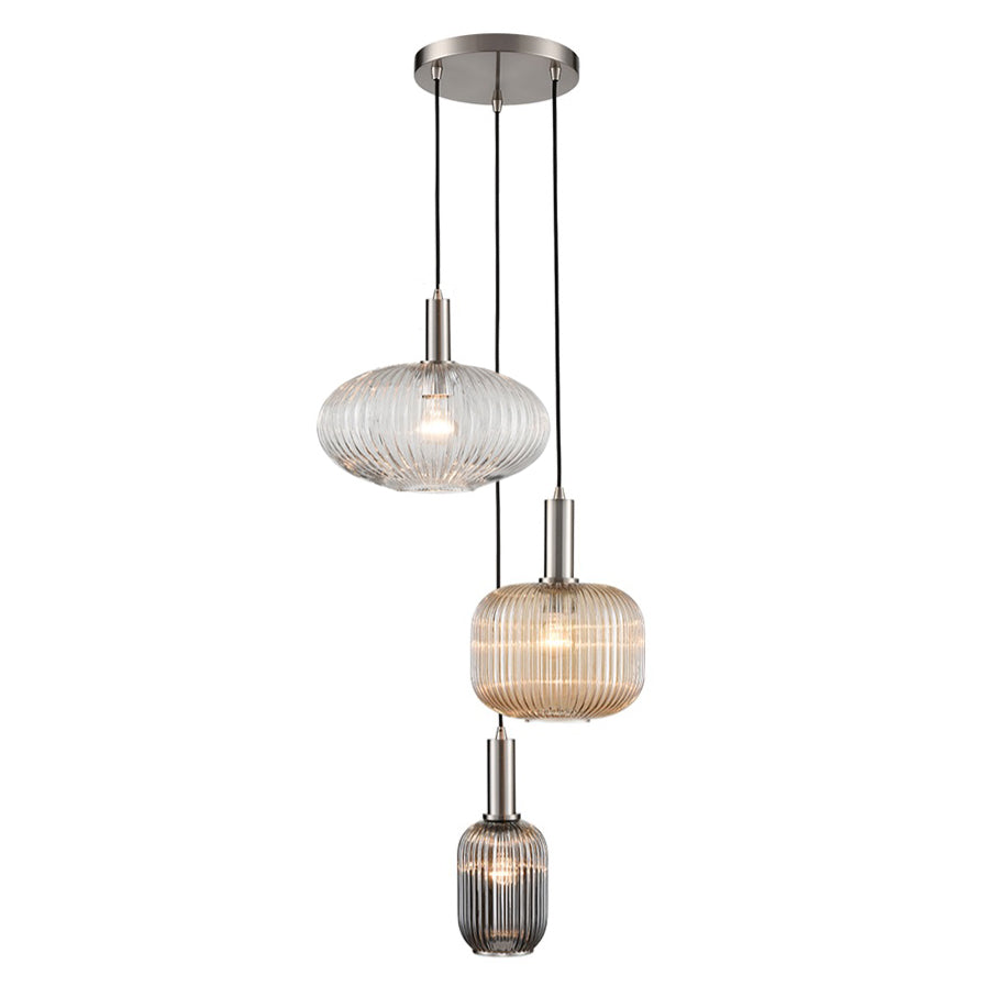 A modern three-tier pendant light fixture with ribbed glass shades in silver, champagne, and smoky gray, suspended from a brushed nickel ceiling canopy on a white background.