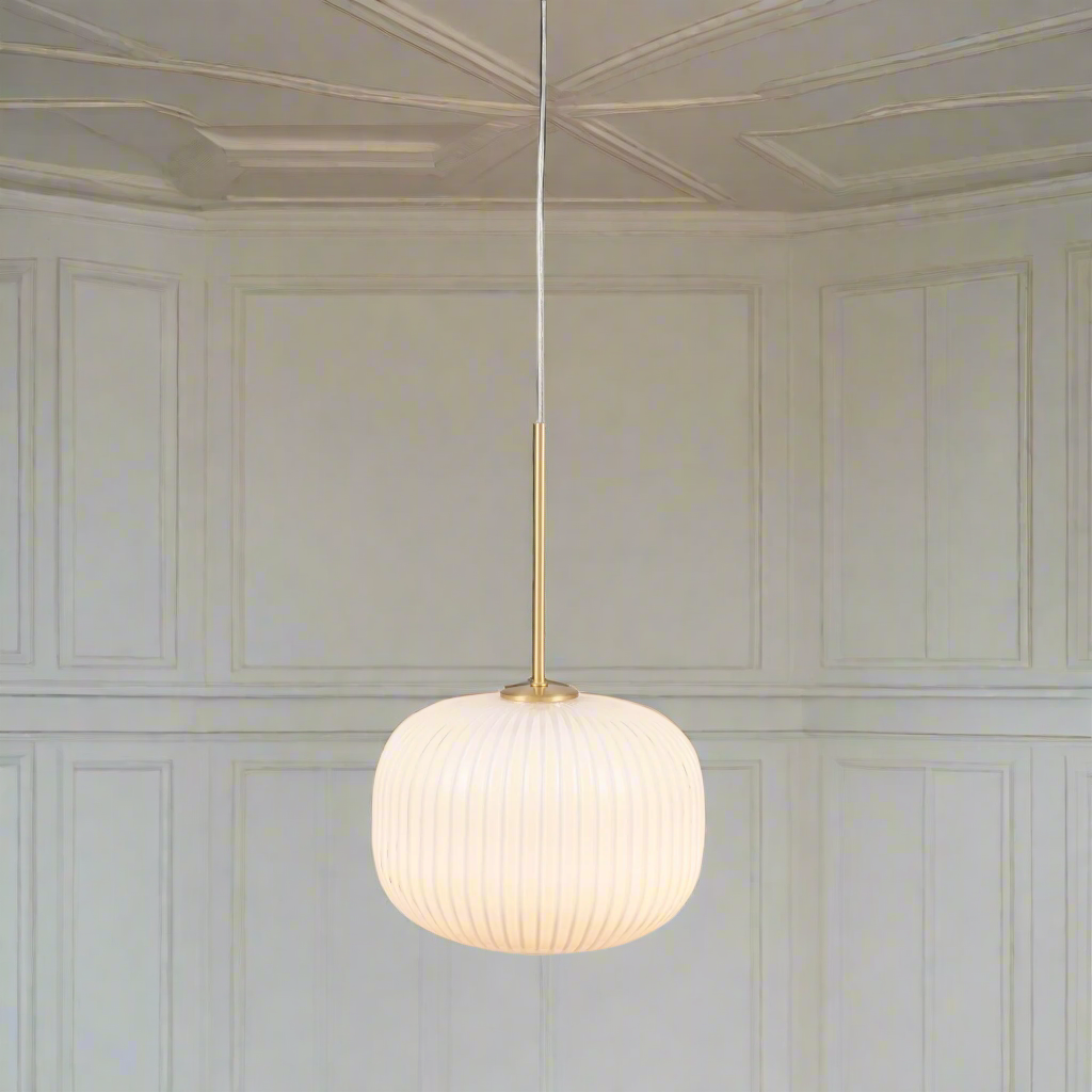 Milk glass ribbed round pendant. Perfect Kitchen Island Light . The opaque glass illuminated with an Led bulb giving a warm glow to any room.