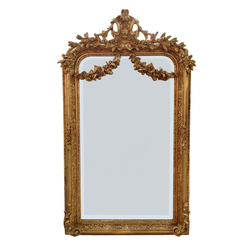 An elaborate mirror, framed with swags, garlands, acanthus leaves and other embellishments in the Georgian neoclassical style, exceptional quality with a beautifully carved wooden frame.&nbsp; Over a console table in your hall, over a period marble or metal fireplace in a living room as a luxurious addition to your bedroom or dressing room, wherever you place this mirror it will enhance your interior adding a touch of luxury.