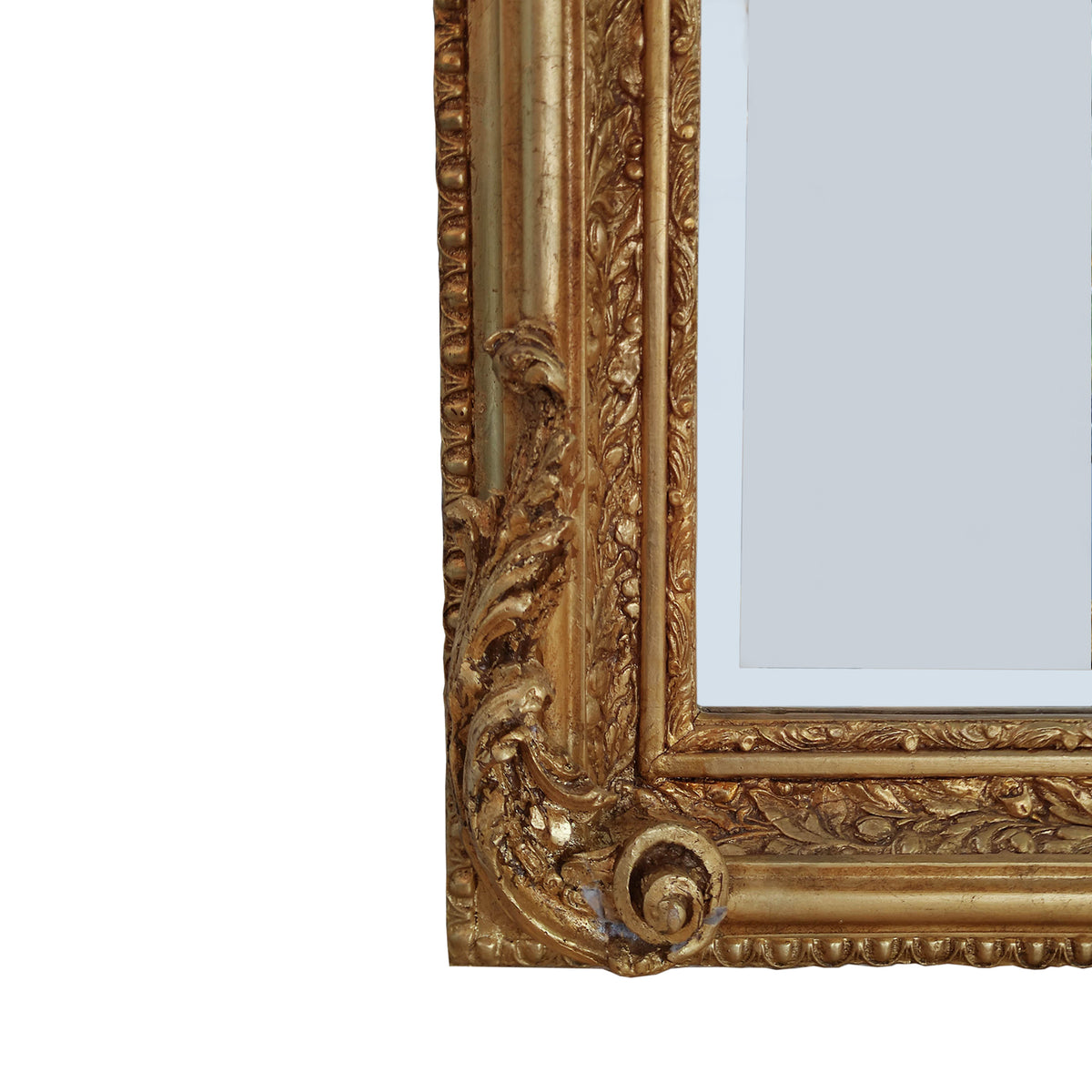 An elaborate mirror, framed with swags, garlands, acanthus leaves and other embellishments in the Georgian neoclassical style, exceptional quality with a beautifully carved wooden frame