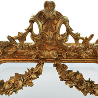 An elaborate, ornate wall mirror, framed with swags, garlands, acanthus leaves and other embellishments in the Georgian neoclassical style, exceptional quality with a beautifully carved wooden frame. Over a console table in your hall, over a period marble or metal fireplace in a living room as a luxurious addition to your bedroom or dressing room, wherever you place this mirror it will enhance your interior adding a touch of luxury.

H: 158 cm W: 85 cm D: 13 cm