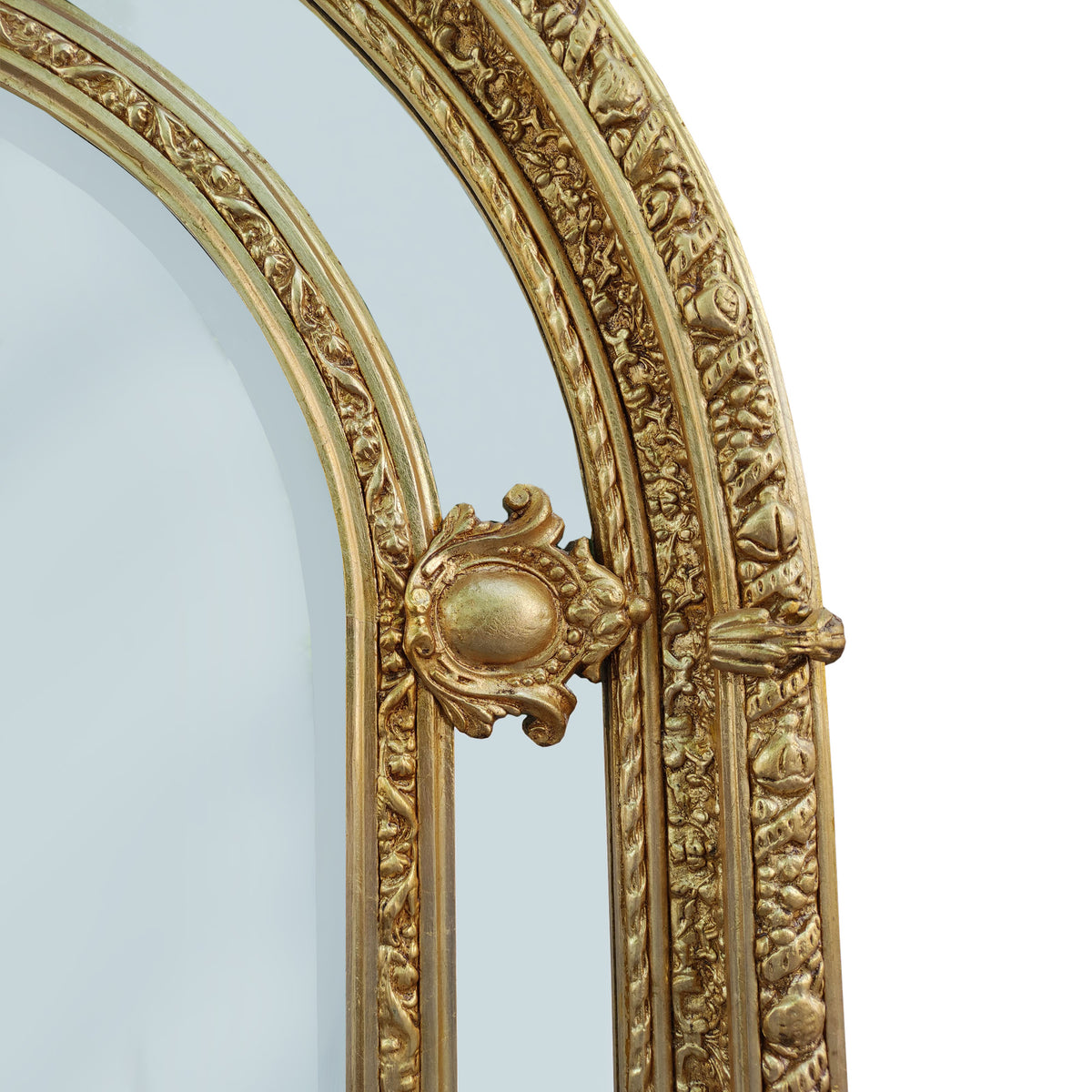 Extremely ornate arched gold mirror with beveled panels.&nbsp; This statement mirror would look amazing in a hallway, just opening up the space and adding a luxurious air to your entryway. In a living room to flash out light and give the illusion of extra space.&nbsp; Stunning rococo revival style with swags and medallions to the crown and heavily ornamented frame. The gilding is a beautifully opulent gilt leaf giving the frame an opulent lustre.&nbsp;&nbsp;

There is no room in the house that would not ben