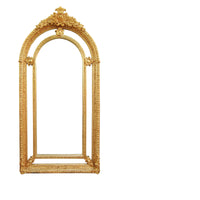 Extremely ornate arched gold mirror with beveled panels.&nbsp; This statement mirror would look amazing in a hallway, just opening up the space and adding a luxurious air to your entryway. In a living room to flash out light and give the illusion of extra space.&nbsp; Stunning rococo revival style with swags and medallions to the crown and heavily ornamented frame. The gilding is a beautifully opulent gilt leaf giving the frame an opulent lustre.&nbsp;&nbsp;

There is no room in the house that would not ben