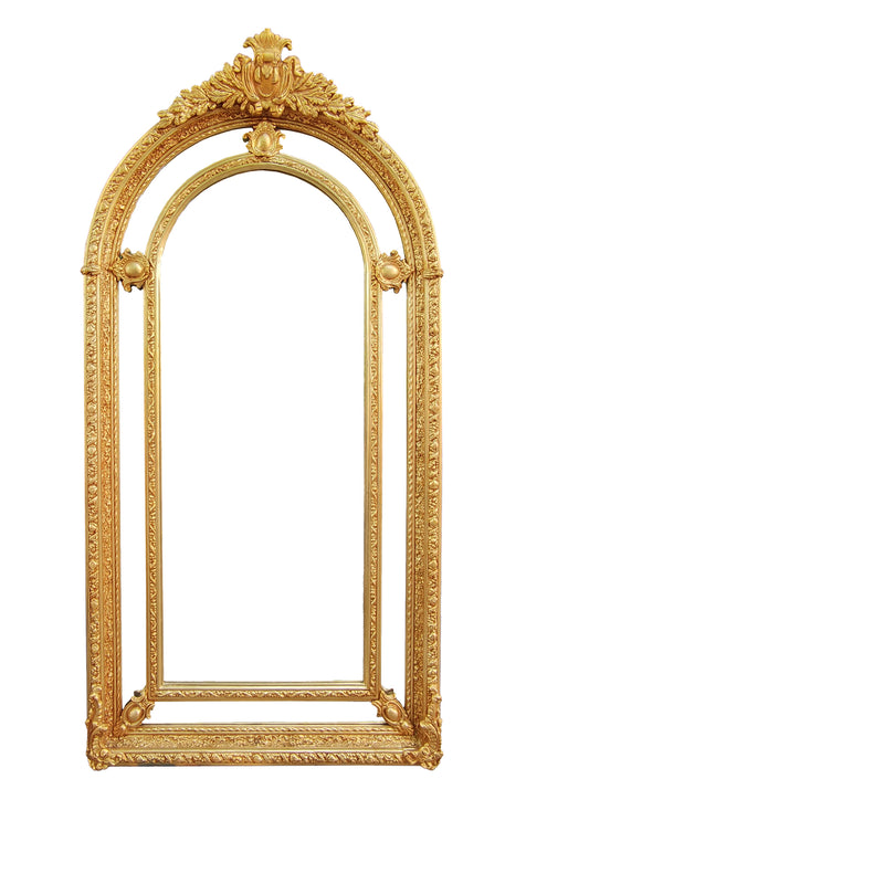 Extremely ornate arched gold mirror with beveled panels.&nbsp; This statement mirror would look amazing in a hallway, just opening up the space and adding a luxurious air to your entryway. In a living room to flash out light and give the illusion of extra space.&nbsp; Stunning rococo revival style with swags and medallions to the crown and heavily ornamented frame. The gilding is a beautifully opulent gilt leaf giving the frame an opulent lustre.&nbsp;&nbsp;

There is no room in the house that would not ben
