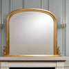 Typical overmantle shaped mirror, the ideal mirror for over your period or even modern fireplace, In a brushed gold colour, this is the classic blend of mirror and mantle