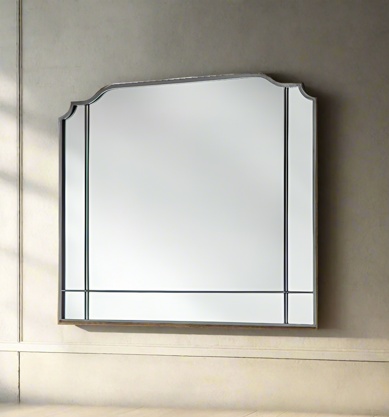 Shaped silver metal paneled overmantle shaped mirror.&nbsp;&nbsp; This 'art deco' style mirror is perfect over a period fireplace or on any wall in your space. Large enough to add space and light to any room. 