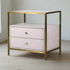 A stunning bedside table consisting of two pale wooden drawers set in a glass and gilt frame. Luxurious bedsides can make a bedroom and this example with sleek metal frame in a brushed brass finish is one of the best.&nbsp; The frame is topped with glass and there is space between the glass and the drawer to be used as a useful open shelf. A great contemporary look, exceptional quality, perfect luxury bedroom furniture.