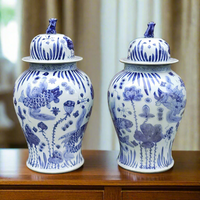 Pair of aged ceramic ginger jars in the traditional Chinese blue and white style. So decorative in any room on any surface, these are tall enough to stand on the floor, either side of fireplace or on a table,&nbsp; Looking good with any style of interior adding colour and interest.