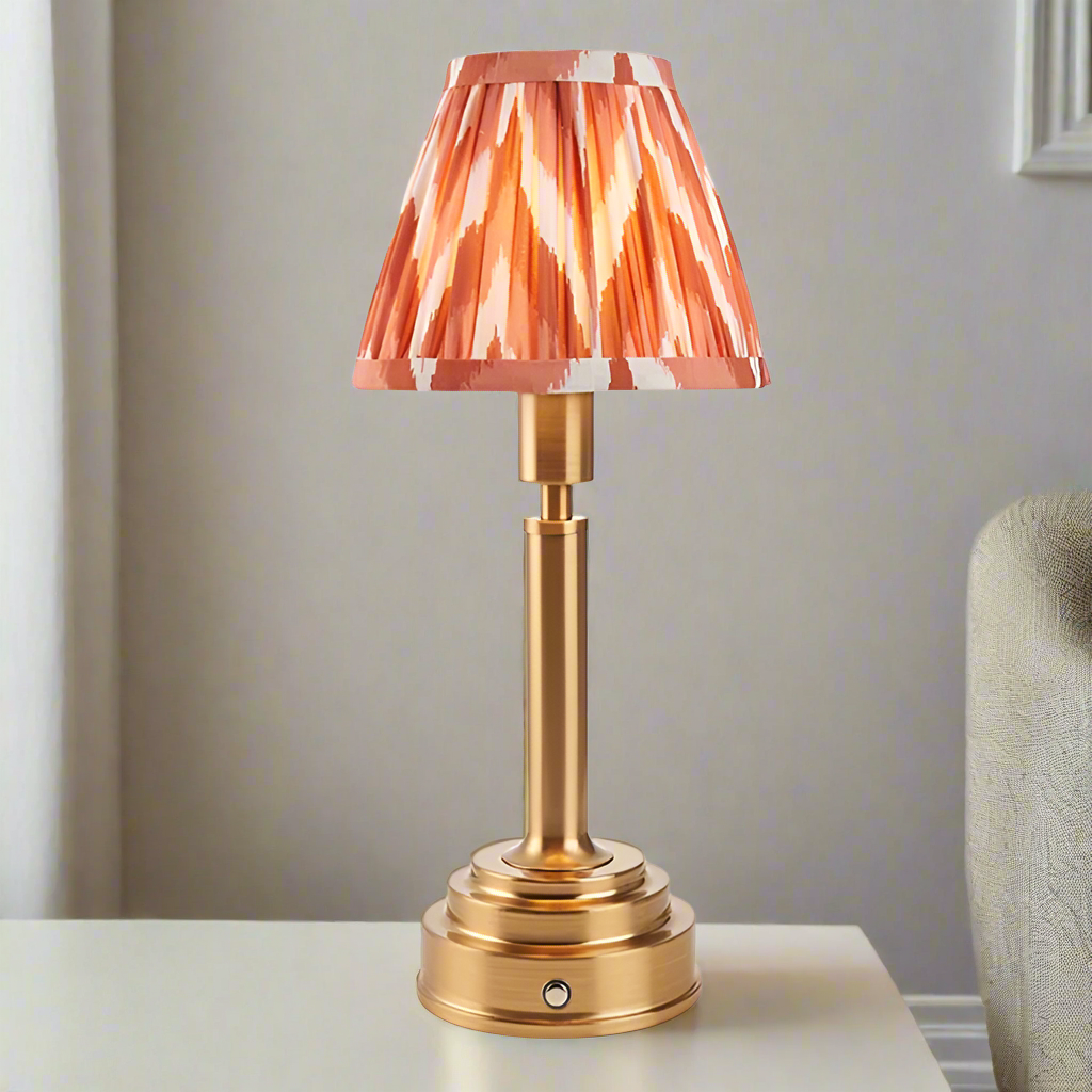 Brushed gold, rechargeable table lamp with a USB port. This portable, rechargeable 3 stage touch dimmer table lamp
