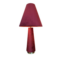 A stunning red velvet lamp and shade, an unusual but very tactile lamp made entirely of red velvet fabric.&nbsp; Perfect bedside lamp, the conical shade is placed onto an inverted conical base connected by an antique brass rod and antique brass base. The perfect way to add colour to a room, a pair of these vibrant lamps will create a warm glow to any interior.