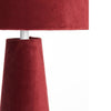 A stunning red velvet lamp and shade, an unusual but very tactile lamp made entirely of red velvet fabric.&nbsp; Perfect bedside lamp, the conical shade is placed onto an inverted conical base connected by an antique brass rod and antique brass base. The perfect way to add colour to a room, a pair of these vibrant lamps will create a warm glow to any interior.