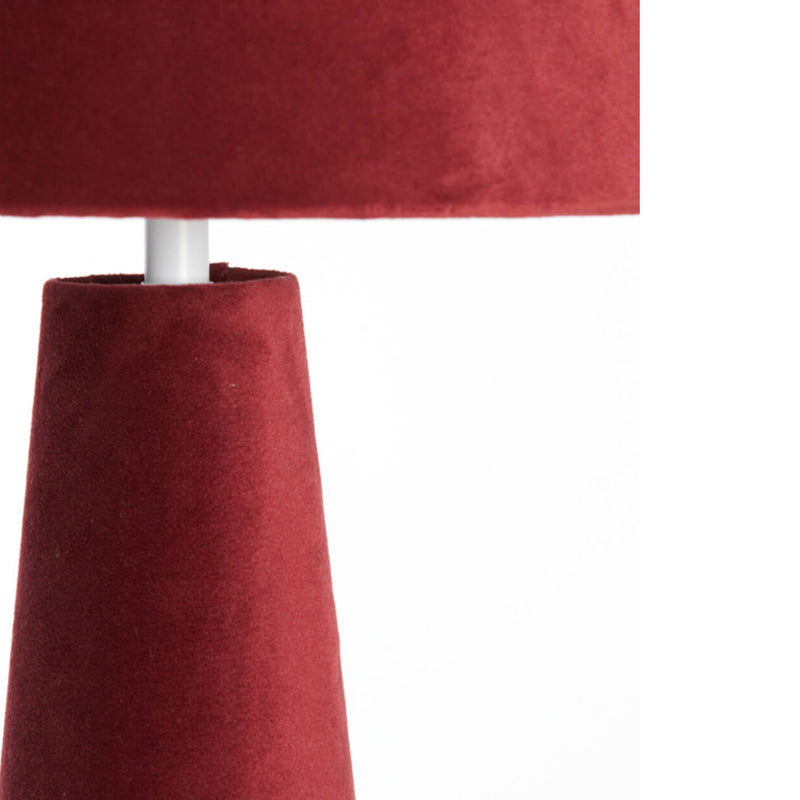 A stunning red velvet lamp and shade, an unusual but very tactile lamp made entirely of red velvet fabric.&nbsp; Perfect bedside lamp, the conical shade is placed onto an inverted conical base connected by an antique brass rod and antique brass base. The perfect way to add colour to a room, a pair of these vibrant lamps will create a warm glow to any interior.