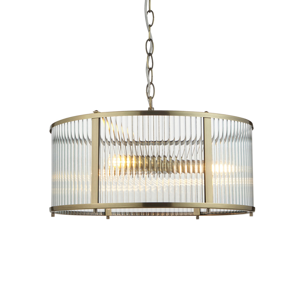 Antique gold, circular ribbed light. A dark gilt colour adds warmth to this 3 light pendant. Perfect hall or sitting room central light with glass ribbed panels. W: 45 cm H: 40 cm (Min) 176 cm (Max)