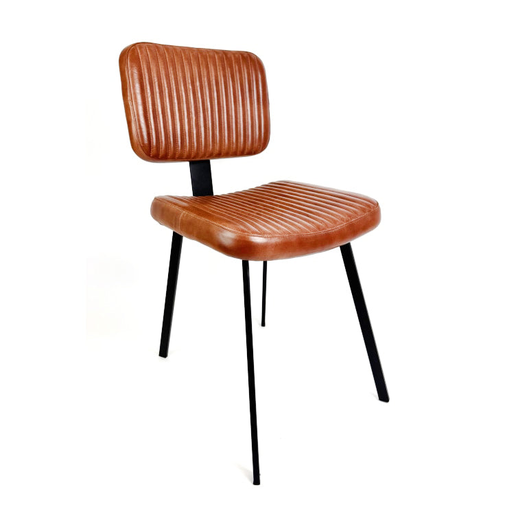 This ribbed dark leather dining chair hand is hand selected by Decorexi for it's vintage industrial style to service your dining or desk space at a totally affordable price.&nbsp;


Made from real leather, this dining or desk chair will transform your seating experience.&nbsp; Contemporary, slim iron legs make this a perfect fit for tables where you don't want the chair to over-dominate.
