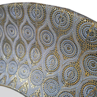 Round wall mirror with patterned moroccan design antique gold frame. Textured metallic finish adds warmth and depth to living rooms, bedrooms, or hallways.