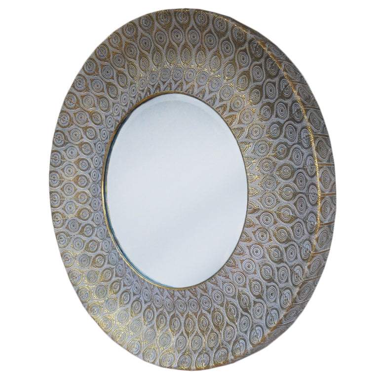 Round wall mirror with patterned moroccan design antique gold frame. Textured metallic finish adds warmth and depth to living rooms, bedrooms, or hallways.
