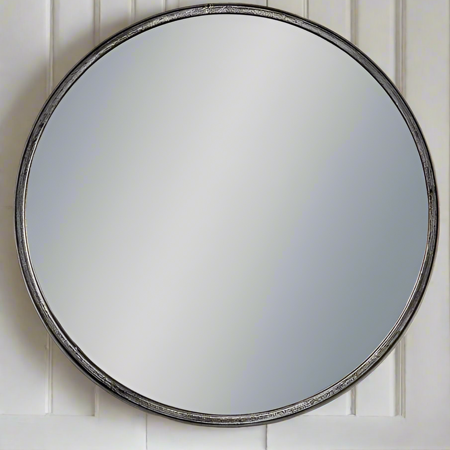 Round, deep framed black mirror with a vintage urban industrial feel.&nbsp; The frame on this mirror is pewter with a galvanised finish.&nbsp; 