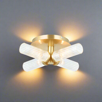 Four light semi-flush style; stunning brushed gold and clear ribbed glass light.
It has an IP44 rate, suitable for a&nbsp; bathroom use. Make your bathroom glamorous!&nbsp; &nbsp;A really versatile light,&nbsp; can be used on ceiling but looks absolutely stunning as a wall light, spreading light from each of each of the four shades.