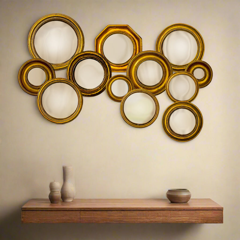 Mini convex gold framed mirrors which come in an assortment of sizes. This is a fantastic price and range which takes the headache out of creating your own wall assortment.