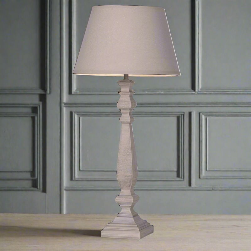 Pretty, turned wooden lampbase with a matching fabric shade, tall and slim enough to sit on the smallest of bedside tables. Classic bedside lighting. For a spare room or even to light a hall or living room.&nbsp;