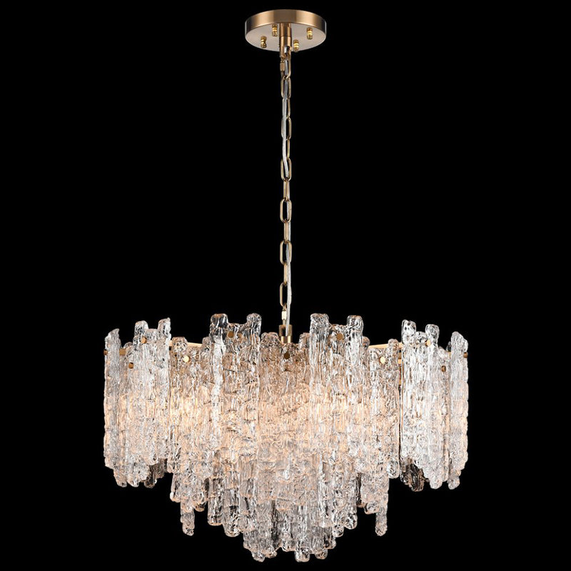 Large chandelier featuring clear textured glass shards of varying heights suspended from an aged brushed‑brass frame and chain.