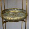 Moroccan style three tier folding stand in antique brass with galleried trays.&nbsp; &nbsp;Can be used in a kitchen, bathroom, anywhere in the house to display or use as extra storage. A great, authentic Moroccan look that works well in a period or eclectic interior.&nbsp; In a conservatory or on a patio covered in plants, bathroom for all those bathing accessories, this unit has so many uses.