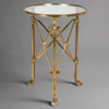 Antique brass and glass occasional table with multi support legs and struts. A really stunning statement side table that will add a lot of style to your sitting room.The main support of 3 antique brass footed legs is complimented by cross braces to give an architectural look. 


