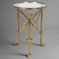 Antique brass and glass occasional table with multi support legs and struts. A really stunning statement side table that will add a lot of style to your sitting room.The main support of 3 antique brass footed legs is complimented by cross braces to give an architectural look. 

