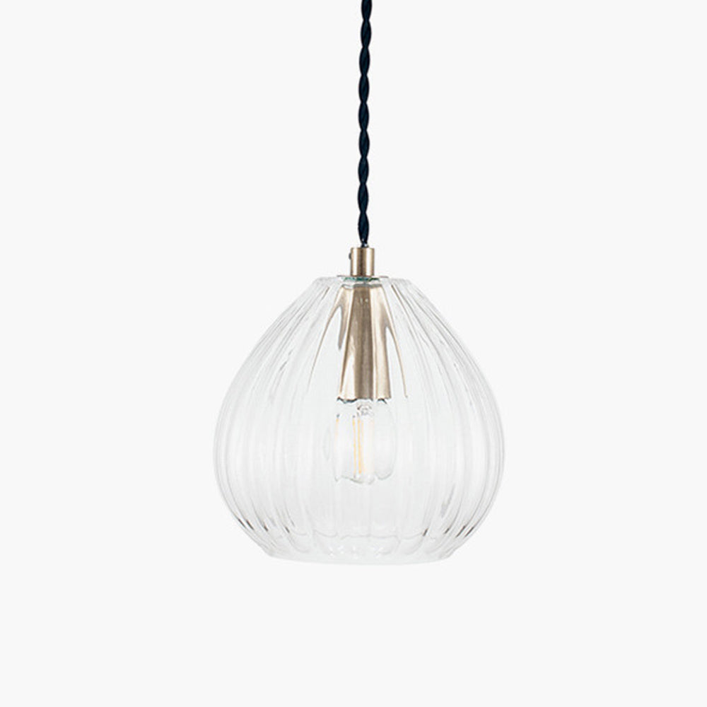 A beautifully simplistic and understated brushed brass glass pendant with ribbed detailing.  16 cm