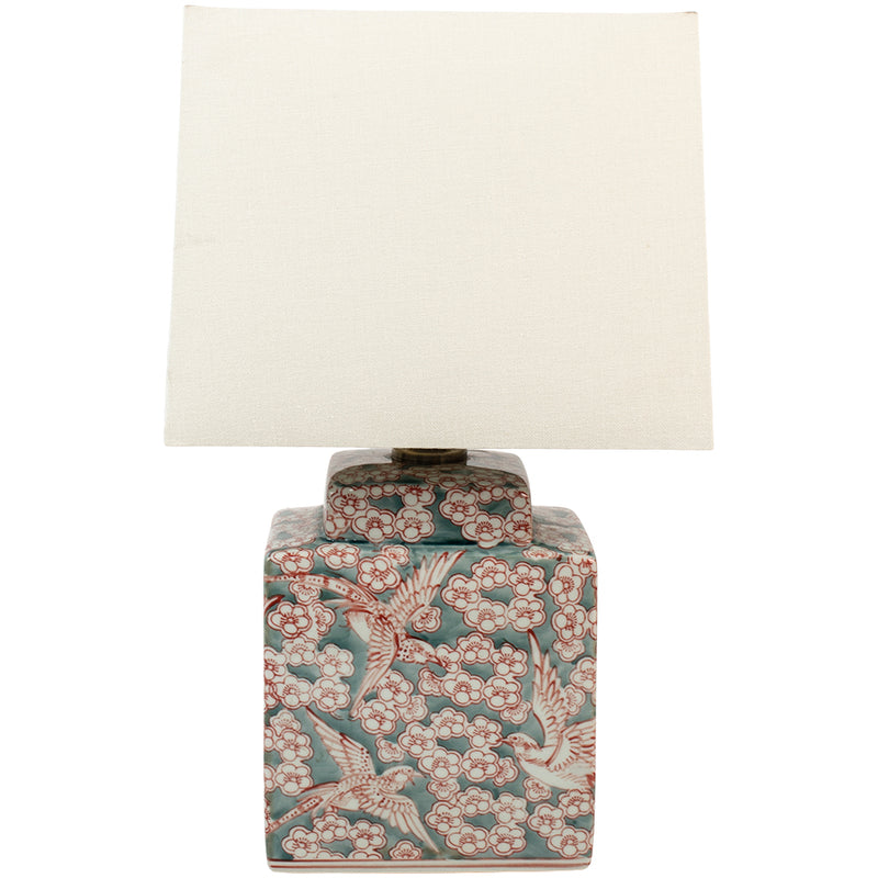 A delicate fauna and flora sage green and red lamp base with a white linen shade.&nbsp; Small enough to use as bedside lamps or as a small side lamp where your space will be transformed into a cosy area.&nbsp; The white linen shades diffuses ample light and you can choose from our recommended bulbs below to get the colour temperature right for your room.  H: 42 cm W: 25 cm D: 17 cm  Requires 1x E27 Edison screw bulb.