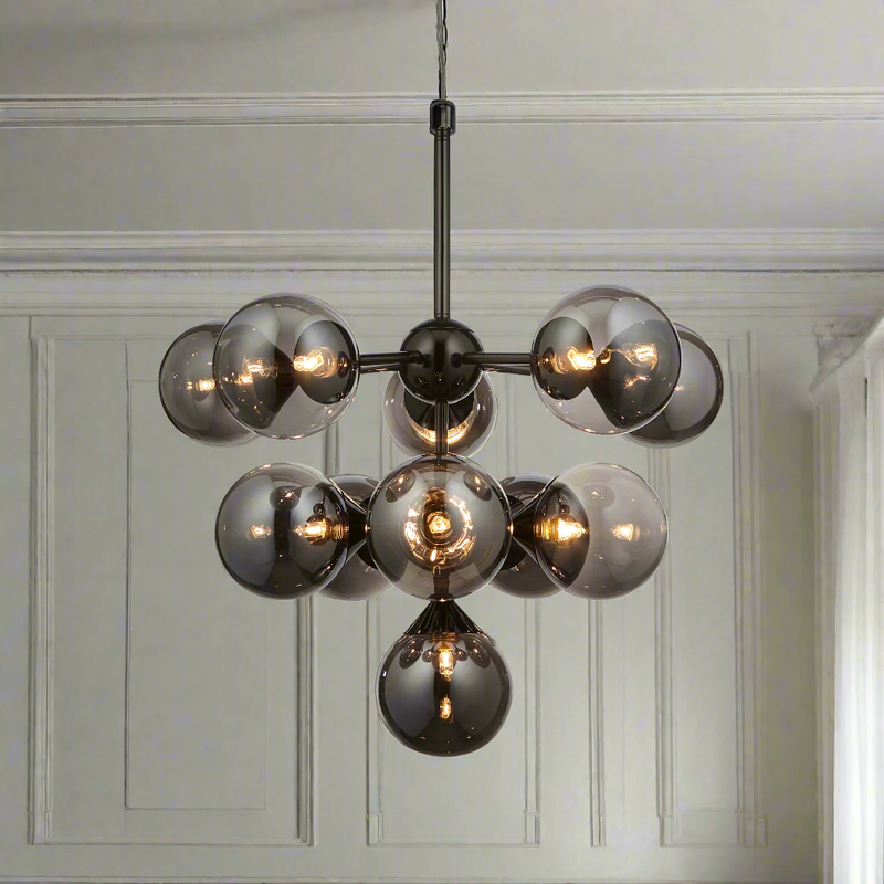 The scale of this 11 ball light makes a huge statement in any room, the matt metalwork and the smoked glass on the globe lights add sophistication and glamour.