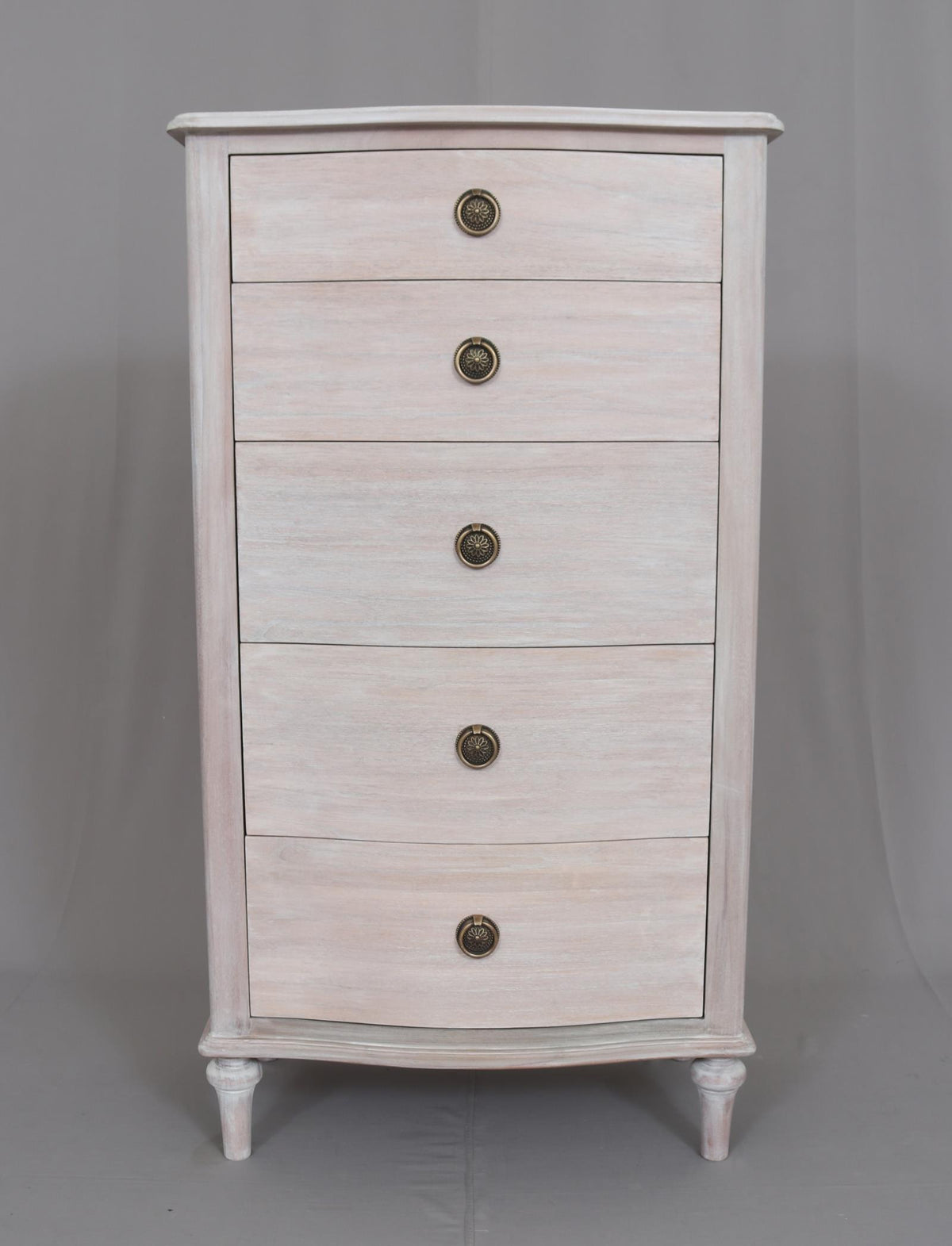 A beautiful five drawer tallboy of superior hardwood quality.&nbsp; This is a very pretty piece made from mahogany wood, finished in an soft white wash veneer finish. The off white finish has warm tones and it's matt, slightly weathered appearance results in a light and airy Skandi feel. Perfect for any living room or bedroom as its neutral finish allows it to blend seamlessly with different color schemes and other furniture styles.&nbsp;&nbsp; A timeless classic storage chest designed to give permanence to
