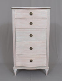 A beautiful five drawer tallboy of superior hardwood quality.&nbsp; This is a very pretty piece made from mahogany wood, finished in an soft white wash veneer finish. The off white finish has warm tones and it's matt, slightly weathered appearance results in a light and airy Skandi feel. Perfect for any living room or bedroom as its neutral finish allows it to blend seamlessly with different color schemes and other furniture styles.&nbsp;&nbsp; A timeless classic storage chest designed to give permanence to