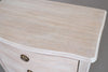 Top view of Wooden Five Drawer Tallboy in soft off white finish, showcasing curved edge design and lime wash texture for bedroom storage.
