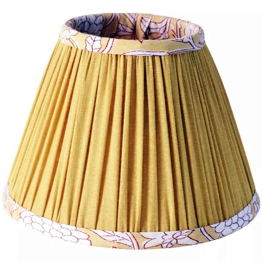 Yellow cotton tapered lamp shade with pleated design and floral trim, ideal for vintage table lamps in home lighting décor.