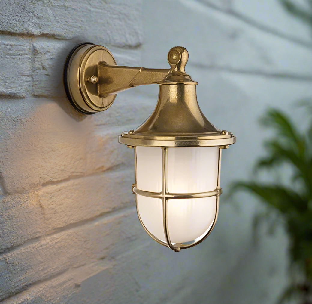 This light is crafted from solid brass, offering a weather-resistant and long-lasting structure. Its frosted glass softens the light, creating a warm, ambient glow. This light combines a timeless, elegant classic design with durability. Perfect for illuminating porches, patios, garden or pathways, providing both functionality and style to outdoor spaces.