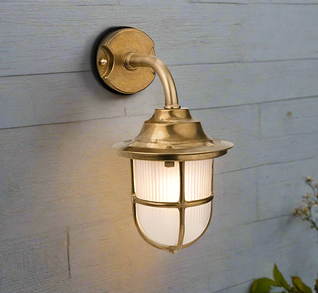 This light is crafted from solid brass, offering a weather-resistant and long-lasting structure. Its frosted glass softens the light, creating a warm, ambient glow. This light combines a timeless, elegant classic design with durability. Perfect for illuminating porches, patios, garden or pathways, providing both functionality and style to outdoor spaces.