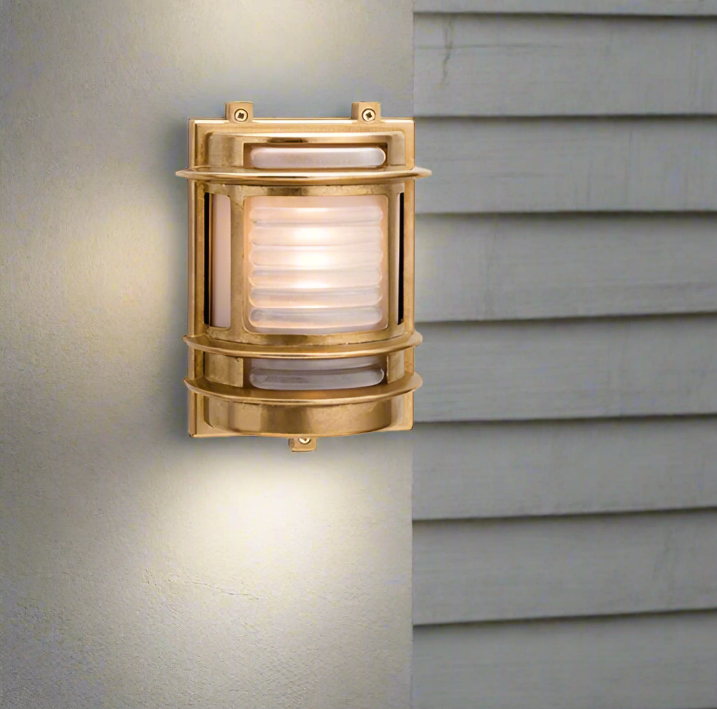 This light is crafted from solid brass, offering a weather-resistant and long-lasting structure. Its frosted glass softens the light, creating a warm, ambient glow. This light combines a timeless, elegant design with durability. Perfect for illuminating porches, patios, garden or pathways, providing both functionality and style to outdoor spaces.