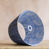 Steel blue tapered cotton lamp shade with pleated exterior and paisley-patterned interior, ideal for vintage or modern lighting decor.